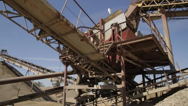 Screening of gravel and sand in a quarry. Extraction of sand and gravel. Environmental pollution