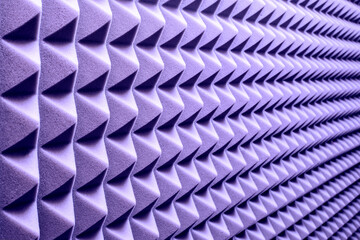 Acoustic foam rubber in a music studio in color lilac shade 17-3938 Very Peri. color 2022...