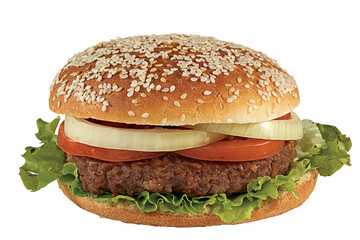 Classic cheeseburger with beef patty, pickles, cheese, tomato, onion, lettuce and ketchup mustard isolated on white background.