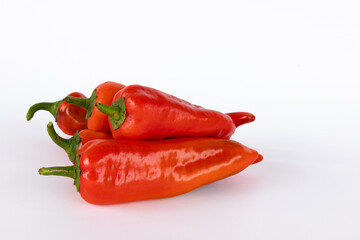 pile of red peppers isolated on white background