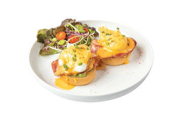 Eggs benedict with bacon on white plate.