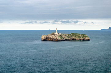 Fototapeta na wymiar Lighthouse on an island in Santander, northern Spain