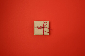 Graft gift box on red background. Paper present box. Top view
