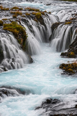 Fototapeta na wymiar Picturesque waterfall Bruarfoss autumn view. Season changing in southern Highlands of Iceland.
