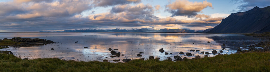Naklejka premium Sunrise Stokksnes cape sea beach, Iceland. Amazing nature scenery, popular travel destination.