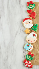 Christmas Concept with Layout Decorated Icing Sugar Cookies Composition. Copy Space for Text