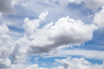 Giant white clouds with cotton texture on a blue sky background