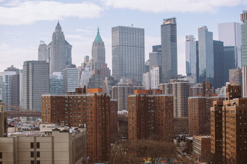Fototapeta na wymiar Lower Manhattan cityscape. View from Manhattan Bridge. Financial District Skyskapers are in the background. New York, USA
