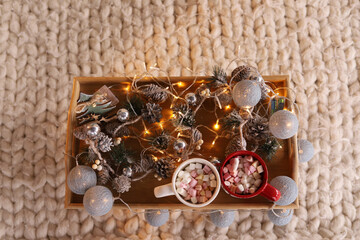Fototapeta na wymiar Cups of marshmallow on a wooden tray, Christmas table