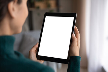 Close up view of Latino woman hold pad device with white mockup screen talk speak online in video...