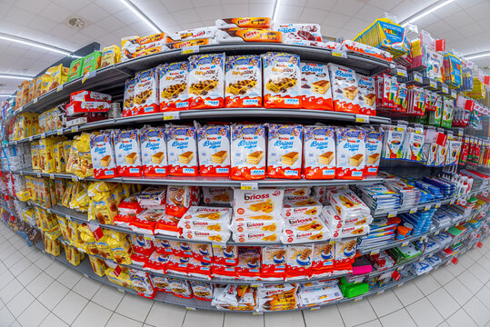 Fossano, Italy - November 25, 2021: Ferrero Kinder, Fiesta, Delice, brioss e Pan e Cioc products displayed on the supermarket shelf, fish eye vision
