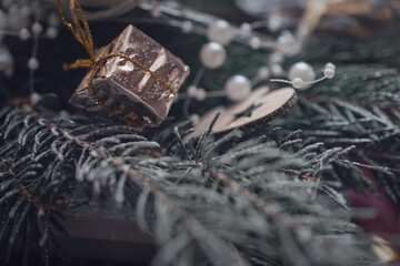 decorating a small gift on the tree
