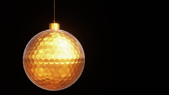 Realistic looping 3D animation of the hanging spinning golden golf ball as Christmas decoration rendered in UHD with alpha matte