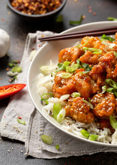 Asian crispy sweet sesame chicken with basmati, wild rice and spring onion.