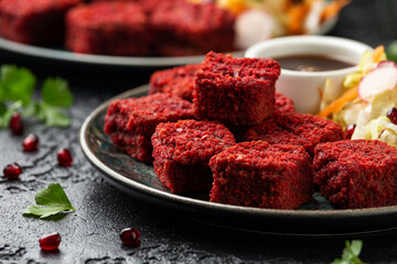 Beetroot and hazelnut bites with pomegranate glaze, vegetarian, vegan party finger food
