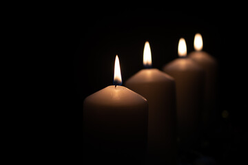 Fourth advent, four candles - candlelight on dark brown panorama background - advent banner....