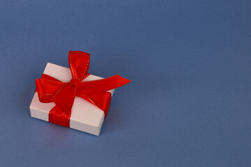 White gift box on a blue background.