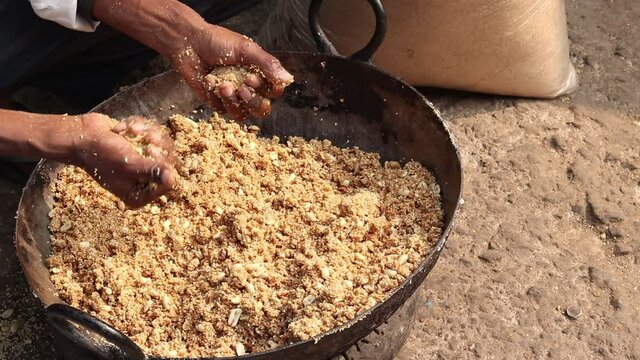 Rolling Roasted Sesame Seeds, Dry Fruits Kaju Badam Moonfali Mawa Malai Mungfali Nuts Mava With Hands To Make Mithai Gajjak Til Gul Gajak Laddu Or Tilgul Gazak Ladoo For Makar Sankranti And Lohri