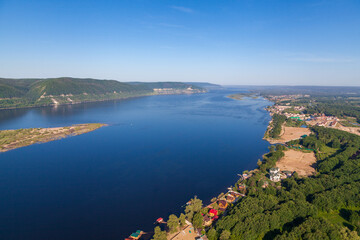 Fototapeta na wymiar View of the Volga River, the village of Shiryaevo and the Volga Islands. Aerial photo. Samara, Russia.