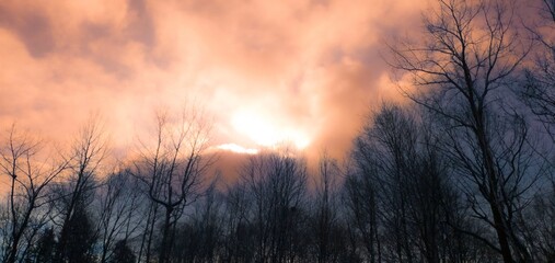 Cloudy December sky with special colors above a public park in Quebec, Canada