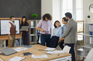 Diverse businessmen having fun, creative thinking at team briefing in office, smiling colleagues, brainstorming discussing ideas in meeting, teamwork concept