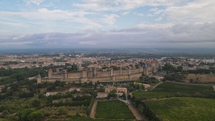 Carcassonne, a hilltop town in southern France’s Languedoc area, is famous for its medieval citadel, La Cité, with numerous watchtowers and double-walled fortifications.