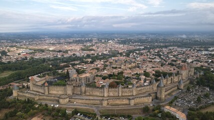 Carcassonne, a hilltop town in southern France’s Languedoc area, is famous for its medieval citadel, La Cité, with numerous watchtowers and double-walled fortifications.