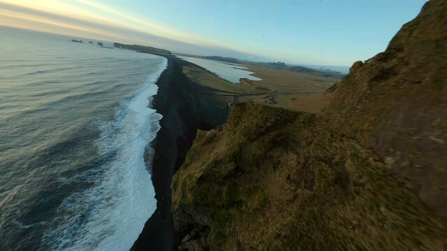 Aerial fpv view of black beach in Iceland. 