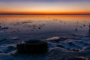 A crimson sunset on the bank of the Volga River on a December evening on the city waterfront!