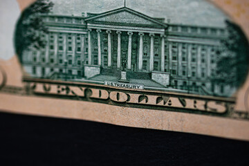 Selective focus on detail of 10 dollars banknote. Close up macro detail of money banknotes, dollars...