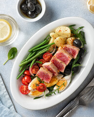 traditional French dish, nicoise salad with tuna, flat lay