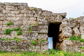 Ruin of a Greek temple at Paestum. Beautiful view of famous Paestum Temples Archaeological UNESCO World Heritage, scenic golden evening light at sunset, Province of Salerno, Campania, Italy