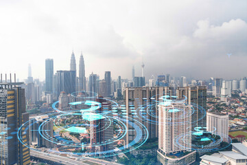 Naklejka na ściany i meble Technology hologram over panorama city view of Kuala Lumpur. KL is the largest tech hub in Malaysia, Asia. The concept of developing coding and high-tech science. Double exposure.