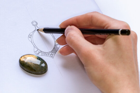 Drawing Jewelry Design. Drawing sketch jewelry on paper . Design Studio. Creativity Ideas.