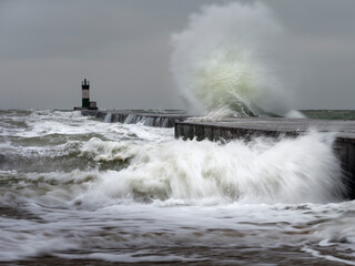 wave above and under pier in storm weather