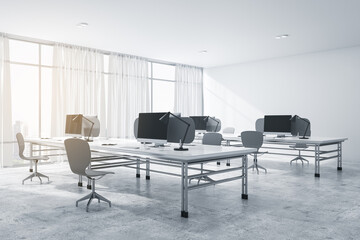 Modern concrete coworking office interior with furniture, equipment, daylight and technology. Workplace and corporation concept. 3D Rendering.