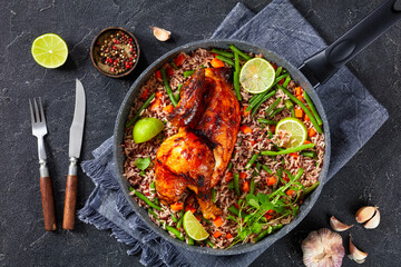 Roasted Half Chicken with brown rice in a skillet
