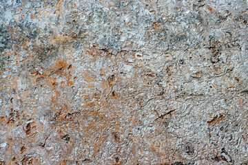 Uneven rough beige-gray texture. Texture of beige rough wall surface. 
