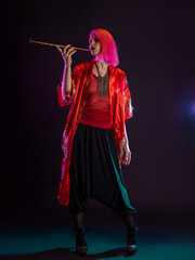 Futuristic look, multicultural outfit, young woman with pink hair in modern trousers, vintage kimono and smoking a pipe in her hands
