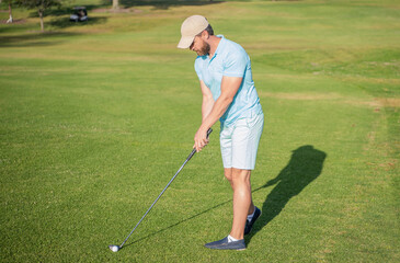 concentrated man playing game on green grass. summer activity. professional sport outdoor.