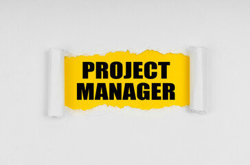 A window is made in the paper, where on a yellow background the inscription - Project Manager