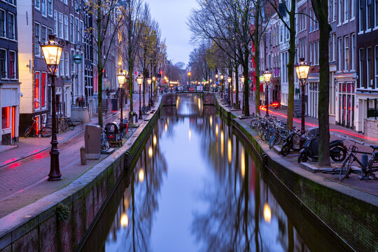 Empty De Wallen, famous red-light district, during morning blue hour, Amsterdam, Holland, Netherlands.