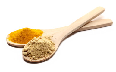 Turmeric (Curcuma) and ginger powder piles in wooden spoon isolated on white  