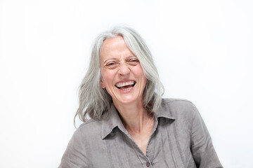 mature beautiful woman with gray hair, laughing out loud