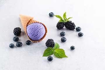 Blackberry purple ice cream in waffle cone