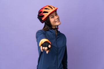 Teenager cyclist girl pointing front with happy expression - obrazy, fototapety, plakaty