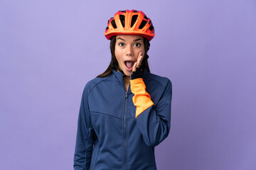 Teenager cyclist girl with surprise and shocked facial expression - obrazy, fototapety, plakaty