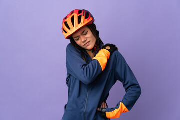 Teenager cyclist girl suffering from pain in shoulder for having made an effort