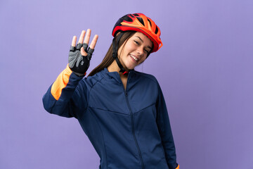 Teenager cyclist girl happy and counting four with fingers