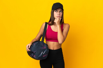 Teenager sport girl with sport bag having doubts and thinking